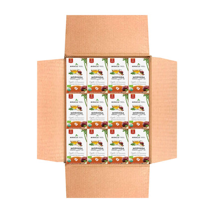 An open cardboard box reveals Miracle Trees Organic Moringa Tea, Apple & Cinnamon, a renowned superfood. The packets feature vibrant green leaves with brown, orange, and white designs. Text highlights the teas organic nature and exceptional quality.