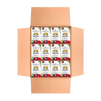 In an open cardboard box are multiple packages of Miracle Trees Organic Moringa Tea, Hibiscus. This superfood, celebrated for its nutrient-dense properties and vibrant packaging, is a delightful and healthful choice.