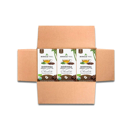 Open Miracle Tree Organic Moringa Tea, Chocolate flavor, featuring three caffeine-free packages in a cardboard box. The design includes teacup and green leaf graphics, proudly displaying the USDA organic label.