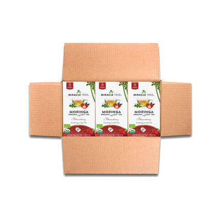 Open Miracle Trees Organic Moringa Tea, Strawberry packs, featuring six caffeine-free superfood tea packs with vibrant strawberry and leaf designs. Enjoy the pure goodness in every sip.