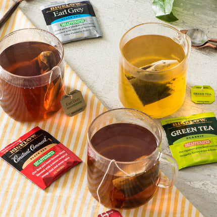Cups of Bigelow Decaffeinate Black and Green Teas in foil overwraps